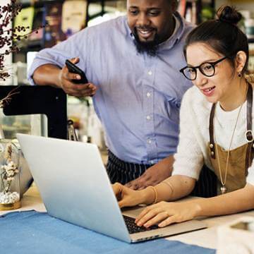 coworkers working on laptop